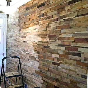 Aplicare solutie etansare pe perete din piatra pentru protectie impotriva umezelii